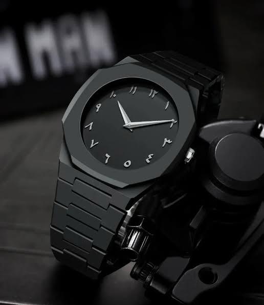 Monochromatic Black Analog Watch with Eastern Arabic Numerals and Geometric Case